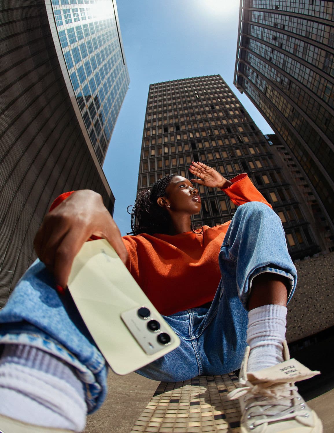 Cellzy campaign: a woman taking a photograph with her phone